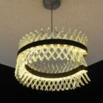 LED Chandelier crafted with brass-finished metal and elegant glass.