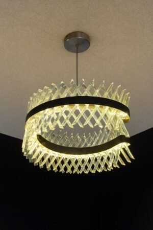 LED Chandelier crafted with brass-finished metal and elegant glass.